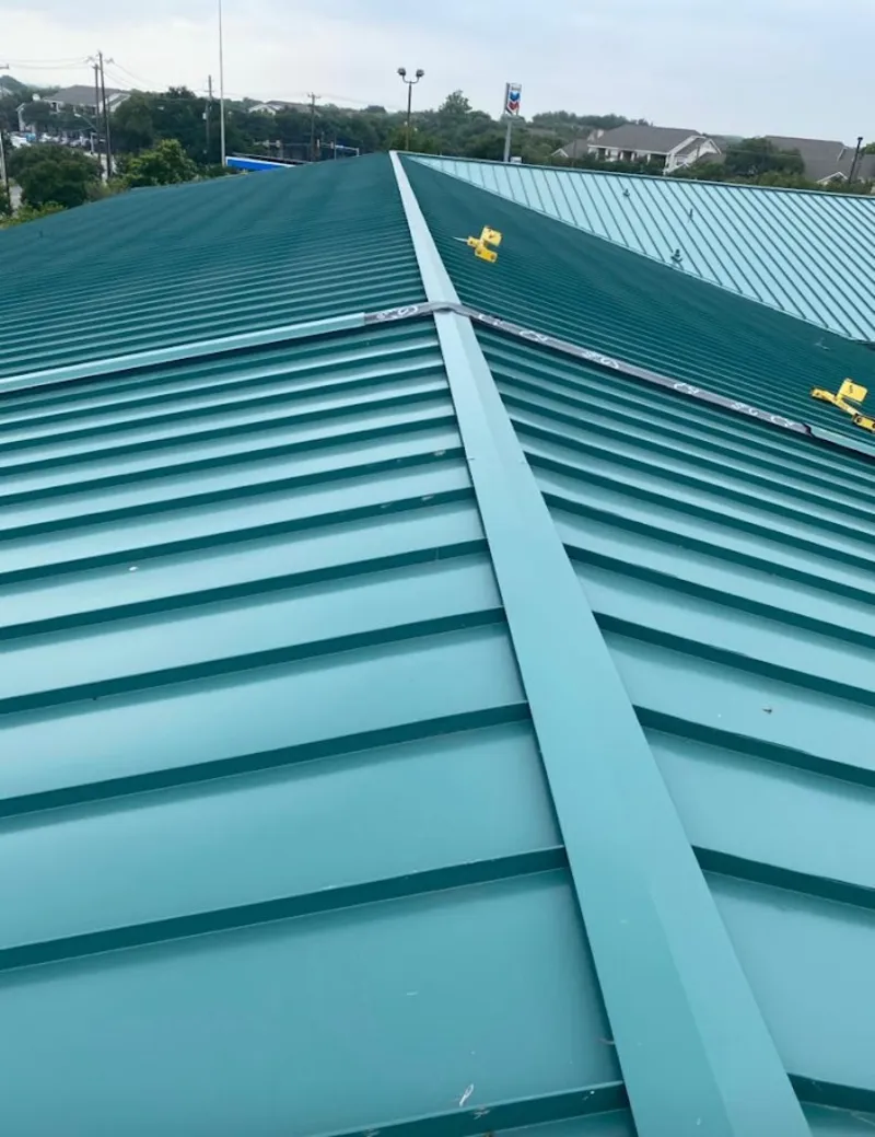 Green commercial metal roof ridge and valley for Metal Roof Repair in Thornapple